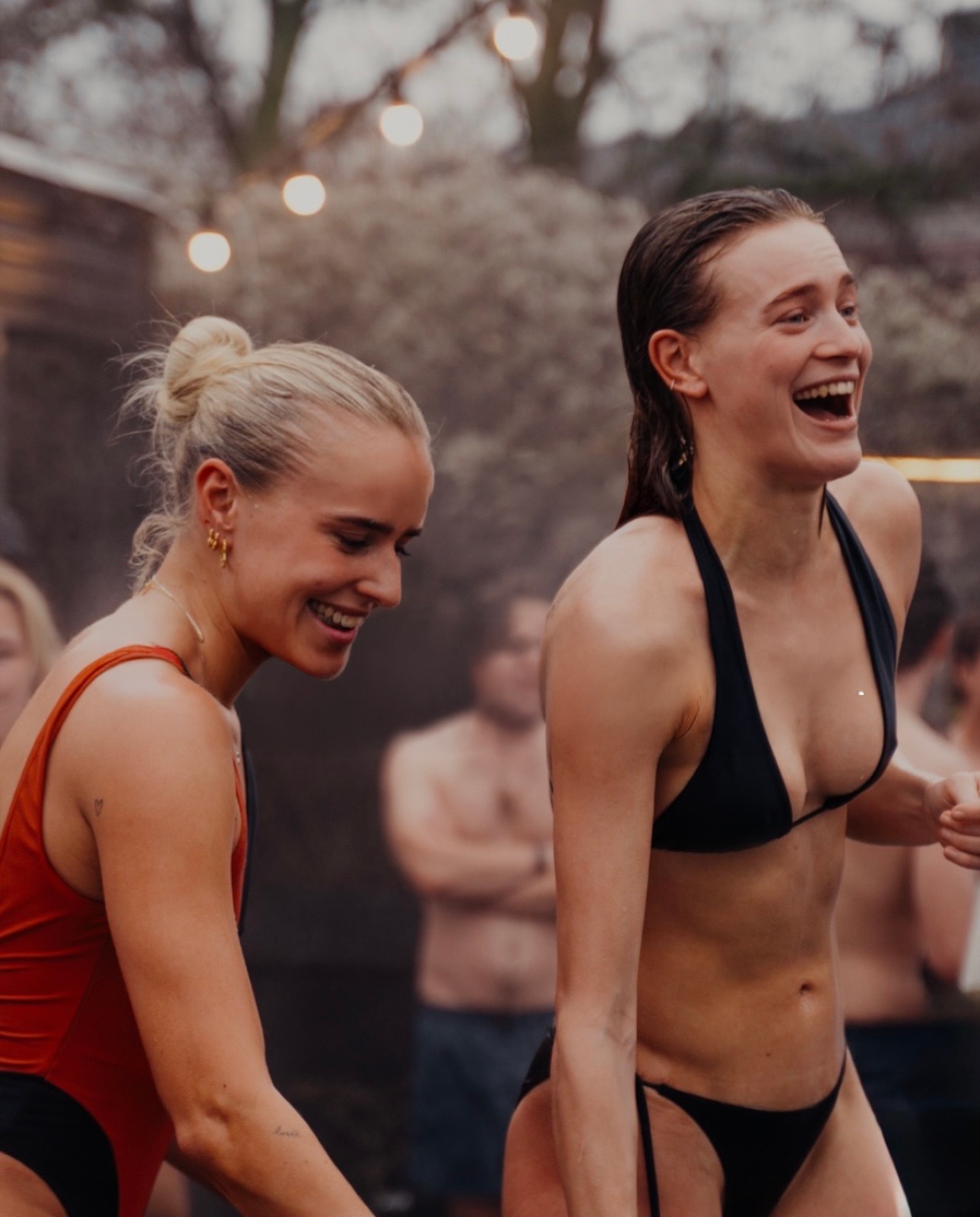 Two friends laughing together after a session